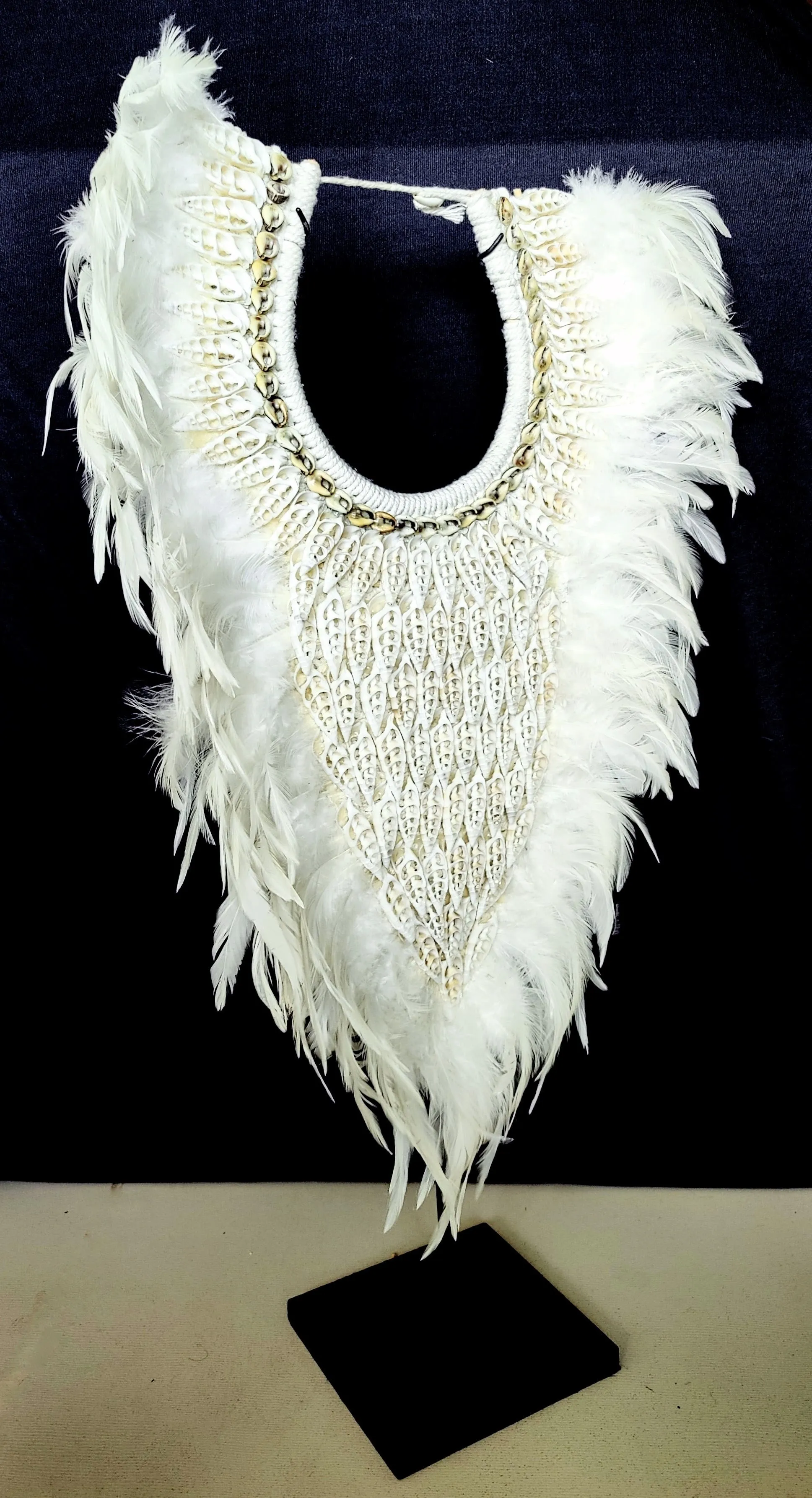 Table Decor: Stunning handmade, white feather and shell necklace from Papua.